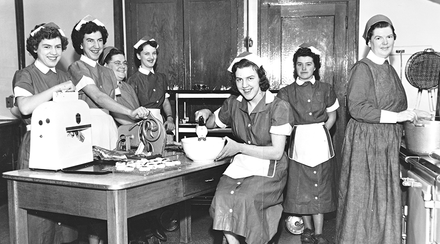 Sister Rosemarie Jansen and staff in kitchen