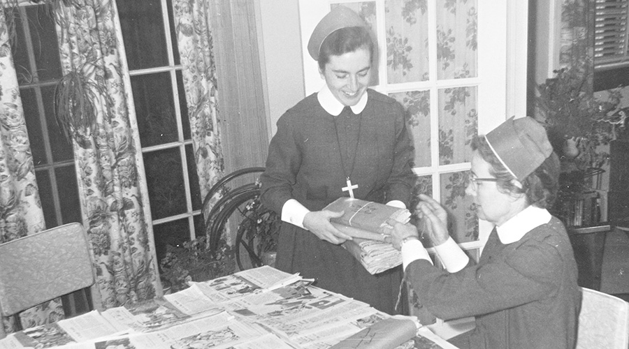 Srs. Marilyn Gillespie and Rita Sullivan bundle Catholic literature