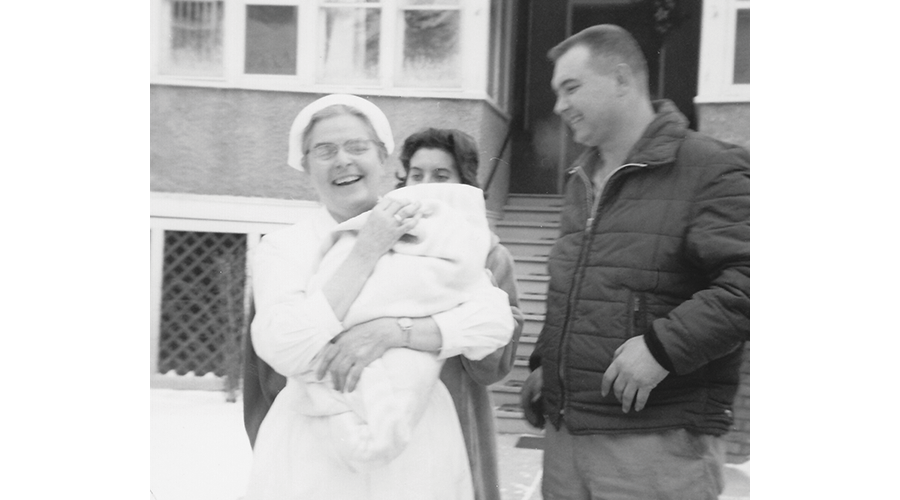 Sister Mary Quinn holds an infant